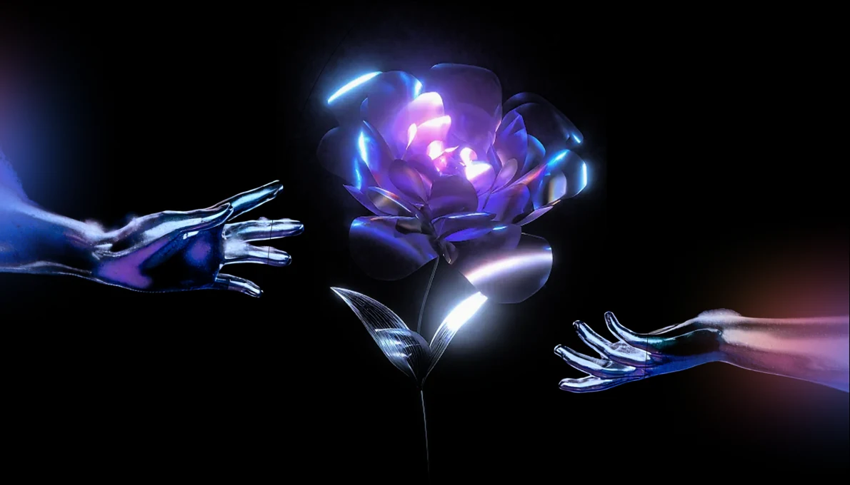 An illuminated flower between two hands — a creative connection