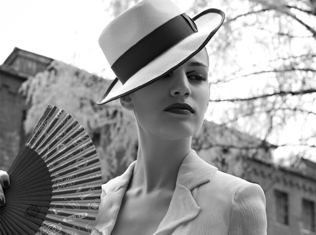 Black-and-white fashion portrait with a wide-brimmed hat